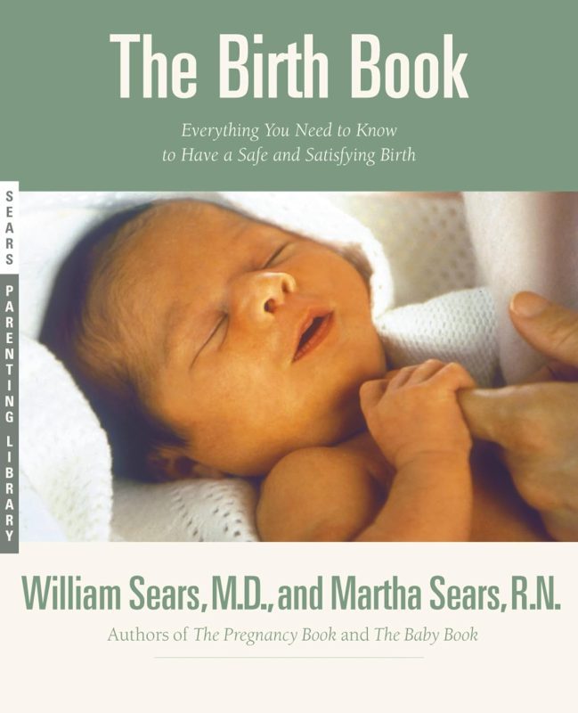 The Birth Book. Image of a newborn baby holding an adults finger. 